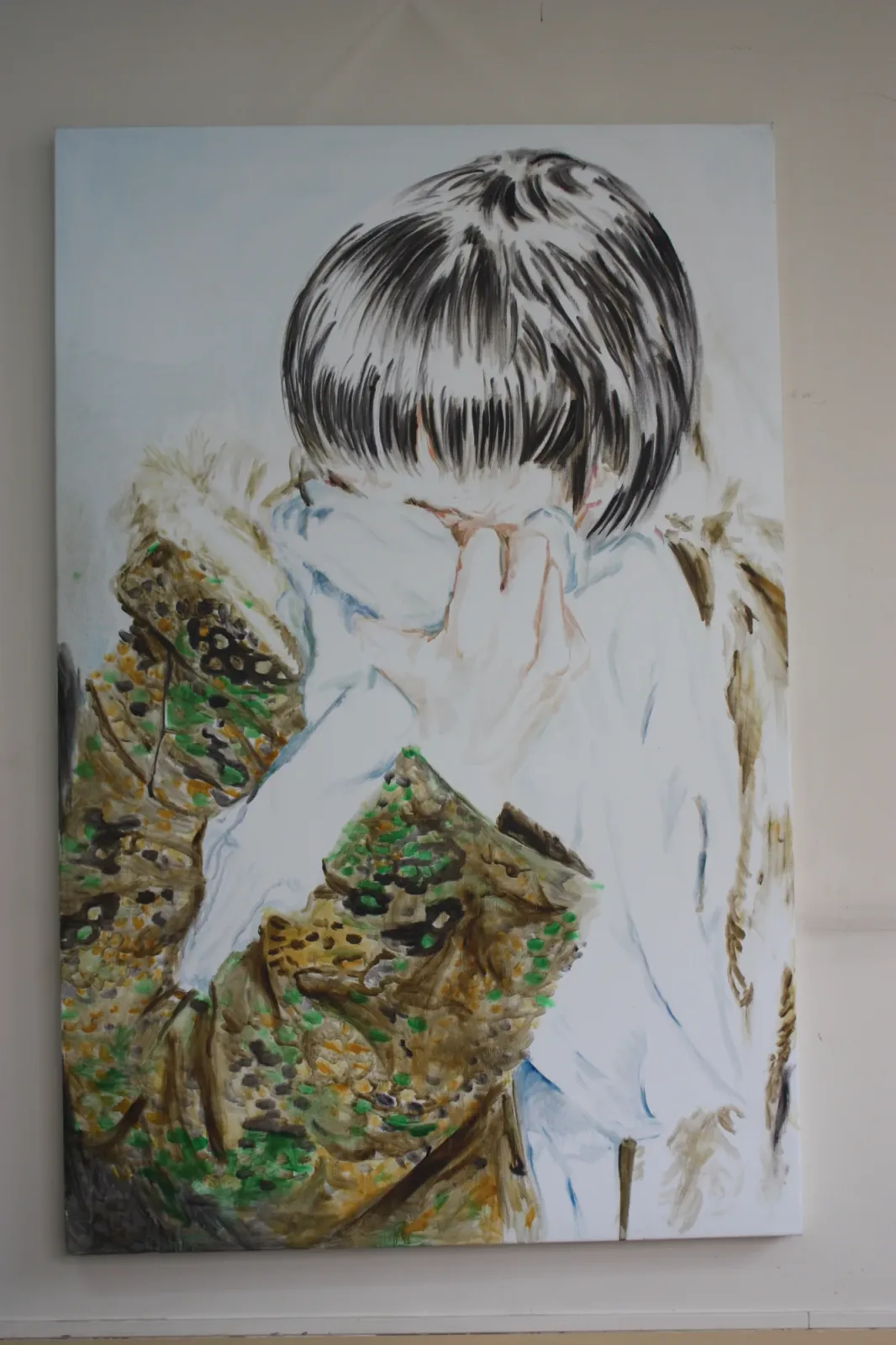 Camouflage, Installation view. The canvas hung on a white wall.